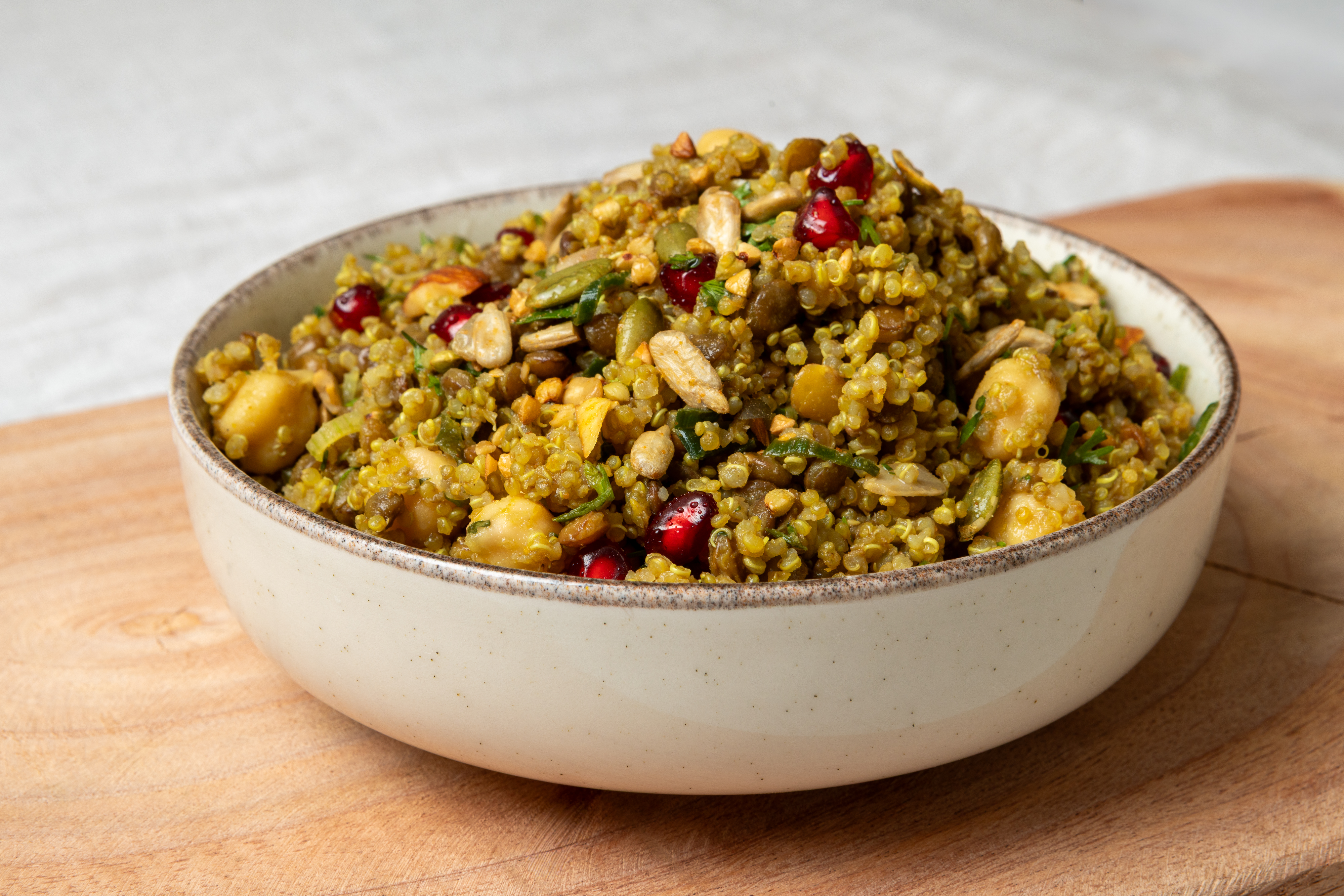 Green millet bowl with almonds and pomegranate